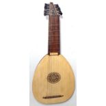 Eight Course Lute by EMS, with fitted hard case. In very good condition and showing almost no sign