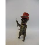 A rare 19th Century cold painted nodding pug dog wearing a top hat.