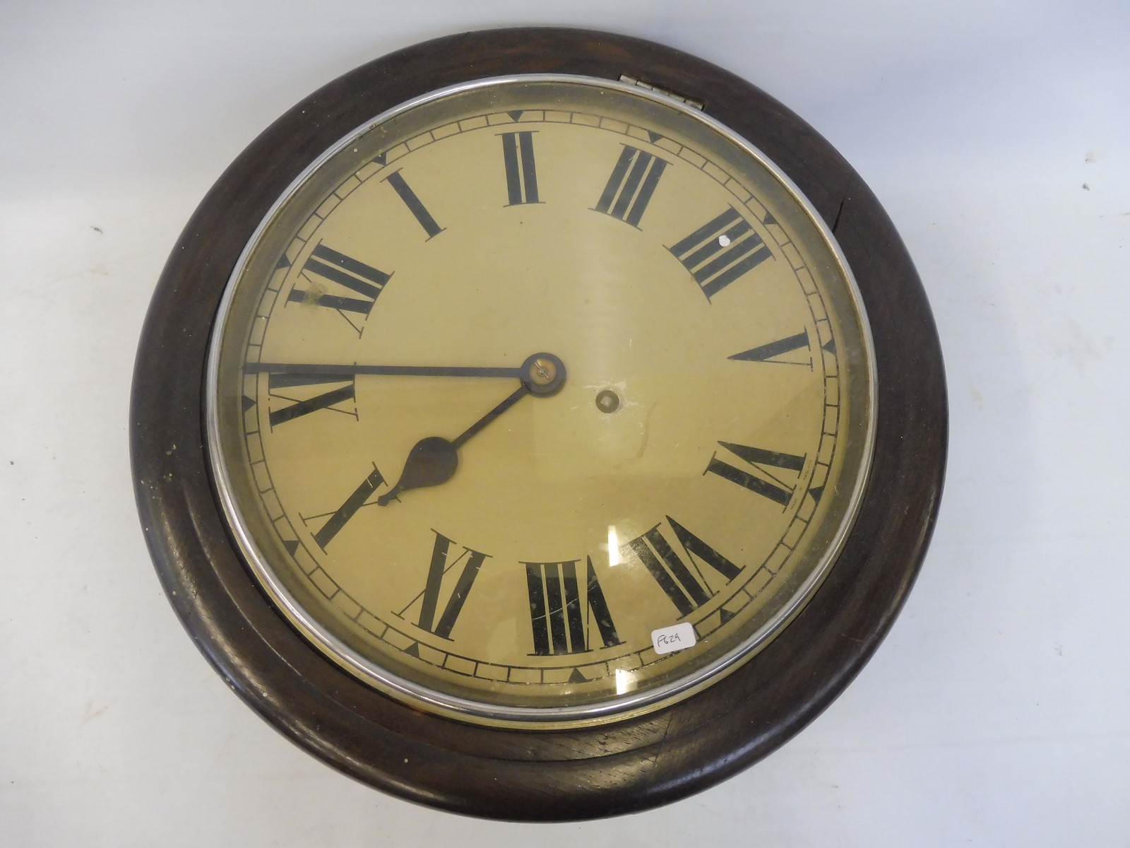 An Edwardian circular dial clock with a single fusee movement.