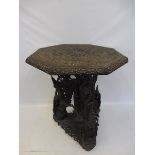 An unusual 19th Century Anglo-Indian octagonal occasional table with heavily carved decoration,