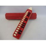 A cased Hohner melodica-alto.