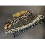 A selection of mostly costume jewellery, plus a small silver filigree flower brooch, MOP etc.