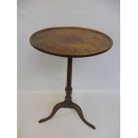 A Georgian oak dish top tripod table.