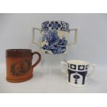 An original Harrods Fulham Pottery terracotta promotional tankard, a 19th Century two handled mug,