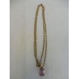 A 9k gold pendant with large pale amethyst on a 9ct gold chain.