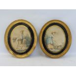 A pair of Georgian oval gilt framed prints with black glass mounts, 11 1/2 x 13 1/2".