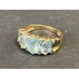 A 9ct gold ring set with aquamarine (one stone missing).
