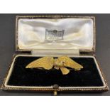 A high quality yellow metal, probably 15+ct gold brooch, in the form of a bird of prey, inset with