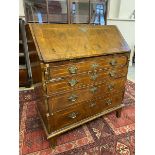 An 18th Century walnut bureau with fitted interior and bible well, 34 1/4" wide.