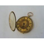 An 18k gold pocket watch.