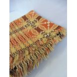 A large Welsh wool tapestry blanket with geometric designs in tones of orange and brown, 86 1/2 x 83