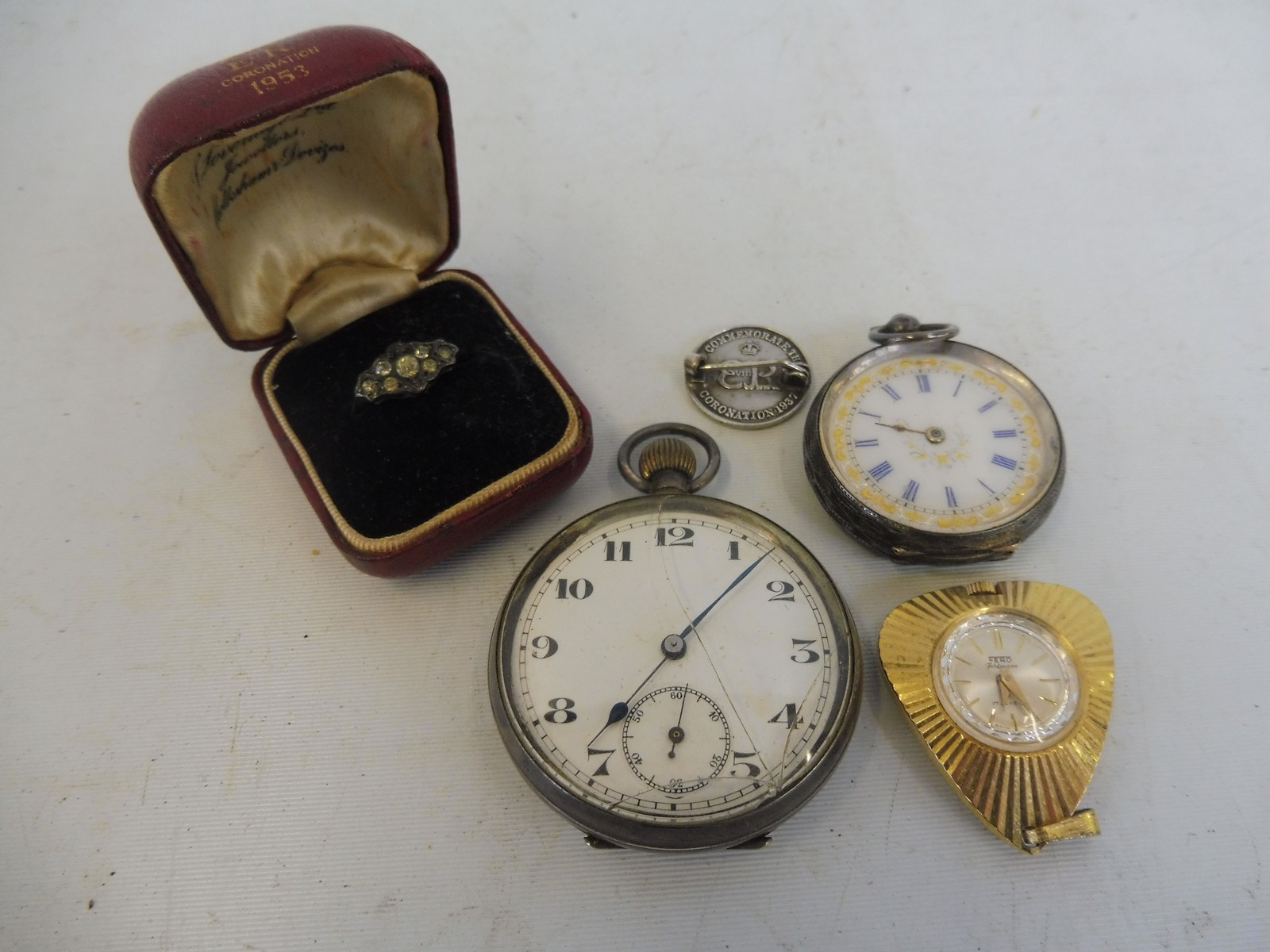 An Edwardian silver pocket watch with enamel dial, one other silver pocket watch, a cased ring etc.