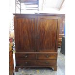 A good quality George III mahogany dwarf press cupboard, the interior with hanging brass rail