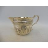 A Victorian silver cream jug, London 1894, maker SB.