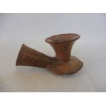 An early Oriental terracotta pipe.