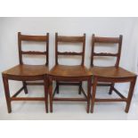 A set of three early 19th Century fruitwood country chairs.