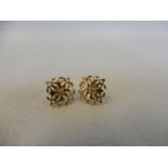 A pair of 9ct gold earrings.