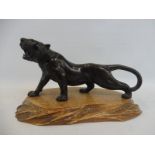 An Oriental bronze tiger, well detailed, bearing signature to base.