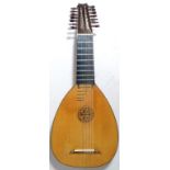 A contemporary English left handed eight course 14 string lute by Peter Owen. Maple back and