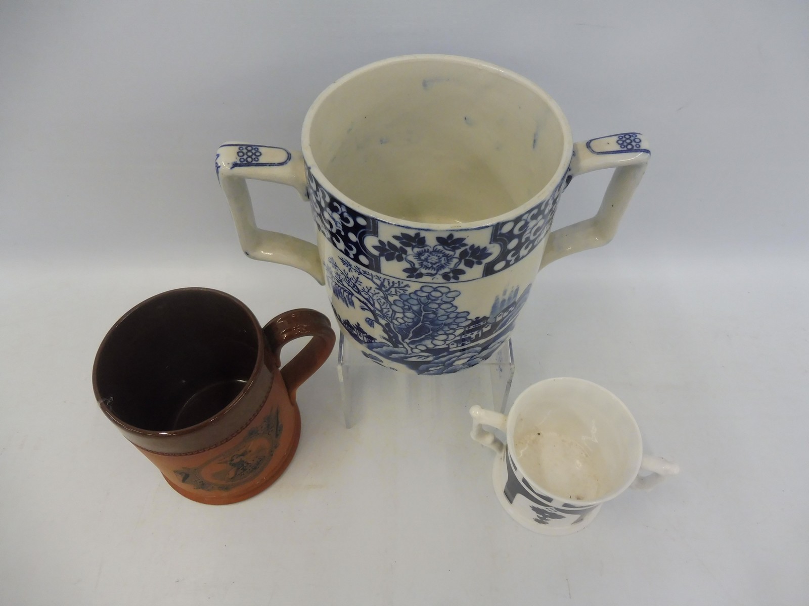 An original Harrods Fulham Pottery terracotta promotional tankard, a 19th Century two handled mug, - Image 2 of 4