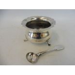 A silver salt with wavy border and three swept supports, Birmingham 1910, plus a silver plated