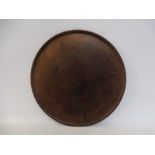 A Victorian circular mahogany tray.