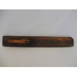 An 18th Century primitive Swedish treen mangle board with inscriptions, 30 1/2 x 4 1/2".