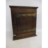 An Edwardian inlaid mahogany miniature cabinet and an oak corner cabinet.