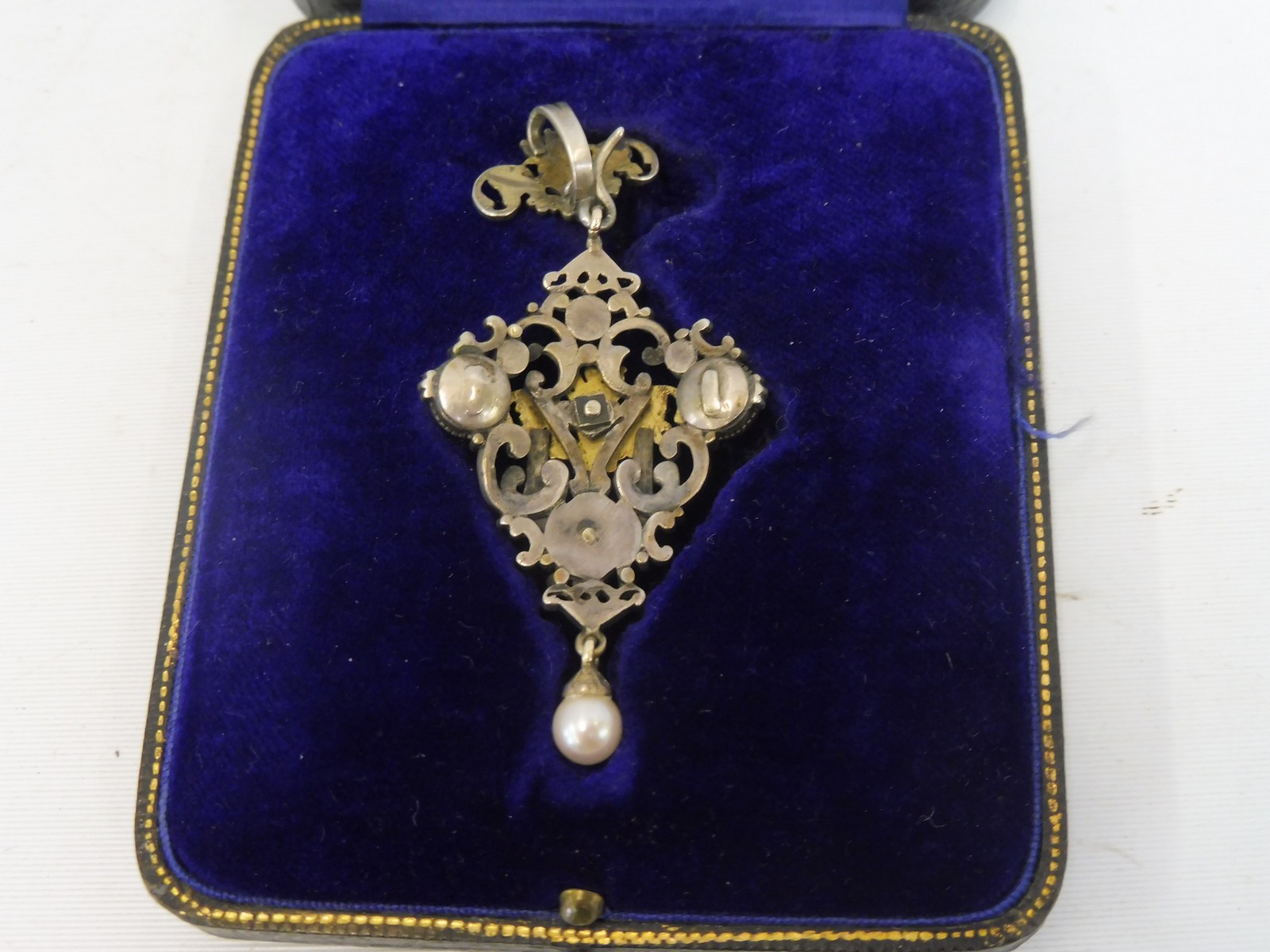 An unusual white metal and gold mounted pendant with central diamond, three further diamonds, two - Image 2 of 2