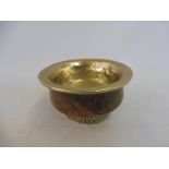 An Oriental treen and brass mounted opium cup.