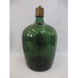 A large green glass bottle with later brass lamp fitting, 16 1/2" high.