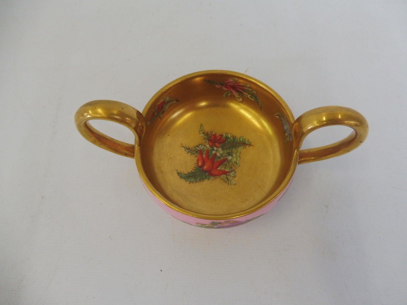 A Coalport porcelain two handled cup with gilded decoration and painted floral sprigs. - Image 3 of 4