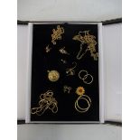 A tray of assorted 9ct gold chains and various yellow metal items.