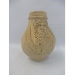 A stoneware belamine jug with detailed bearded mask to the front.