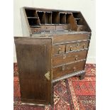 An 18th Century oak bureau of small proportions with stepped interior and bible well, 27" wide.