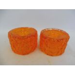 A pair of Whitefriars baxter bark orange glass candlesticks, 2 1/4" high.