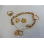 A 9ct gold bracelet with padlock clasp, a 9ct gold wedding band, a further 9ct gold padlock, a