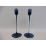 A pair of slender Scandinavian blue glass candle holder, 7 3/4" high.