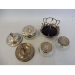 A selection of silver including a ring tree, three silver lidded glass dressing table pots and a pin