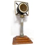 Free standing microphone marked Grampian Public Address Equipment, metal on wooden base, head