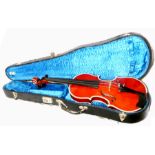 An interesting full size violin with case.