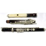 A 19th century ivory head rosewood 13 key flute. Nickel keys and mounts. Brass lined head joint with