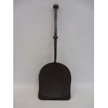 A Georgian iron shovel, the handles of unusual scalloped design, 16 1/2" long.
