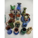 A collection of Devon pottery vases including Torquayware.