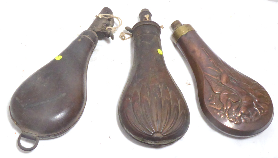 Three 19th century powder flasks.