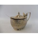 A Georgian silver oval mustard pot or similar, with a wide band of floral decoration, London 1806,