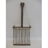 An 18th Century iron trivet/toasting platform.