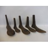 A decorative set of five 19th Century cast iron boot lasts.
