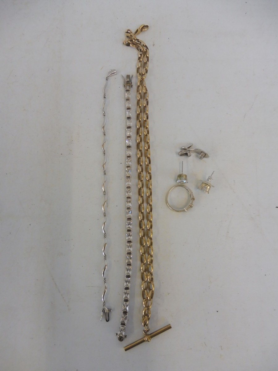 A small group of jewellery including a white gold ring, a yellow metal watch chain etc.