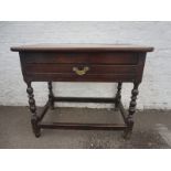 A 17th Century walnut and oak side table of good colour.